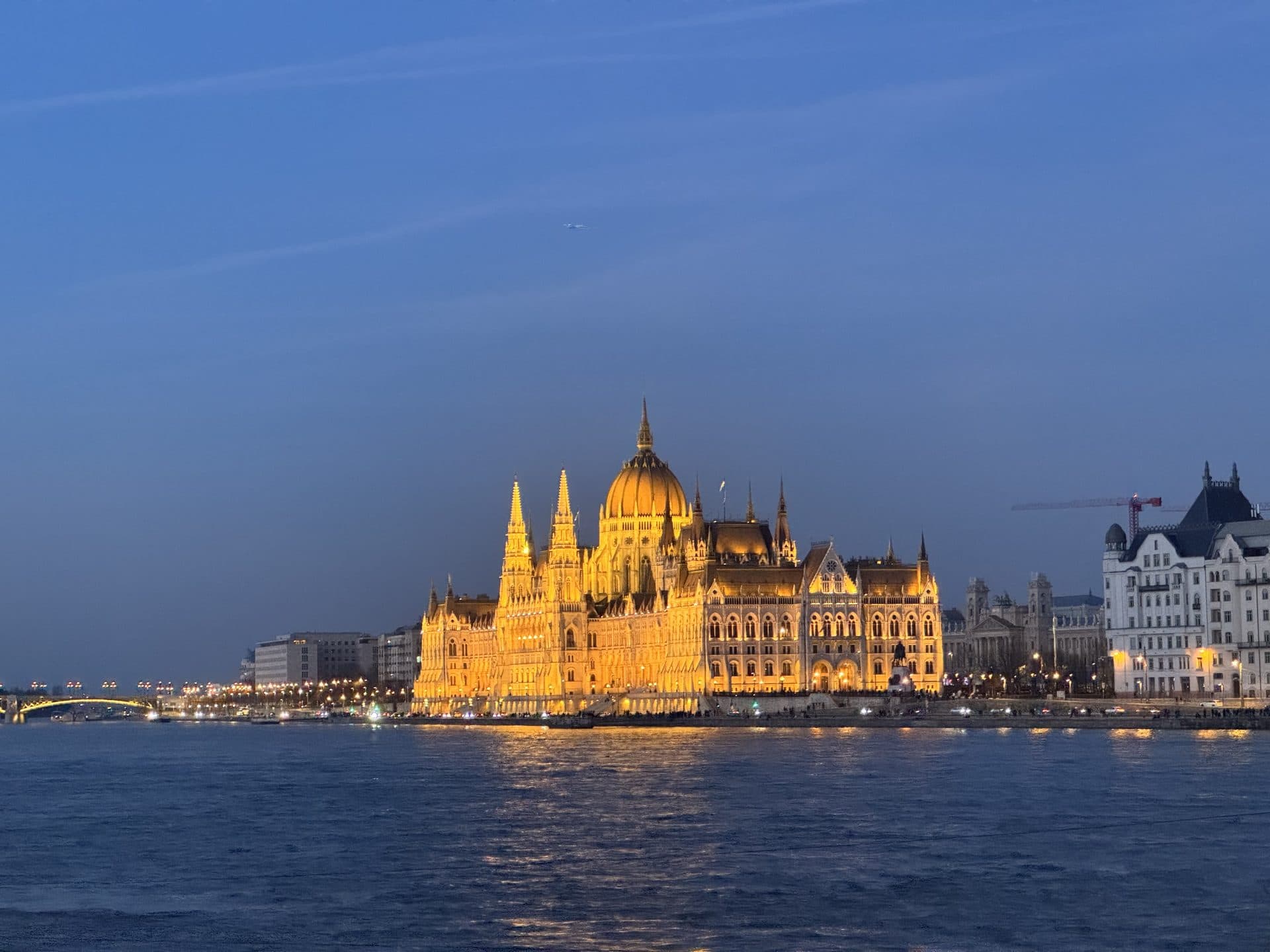 Parliament building at dusk from across the river