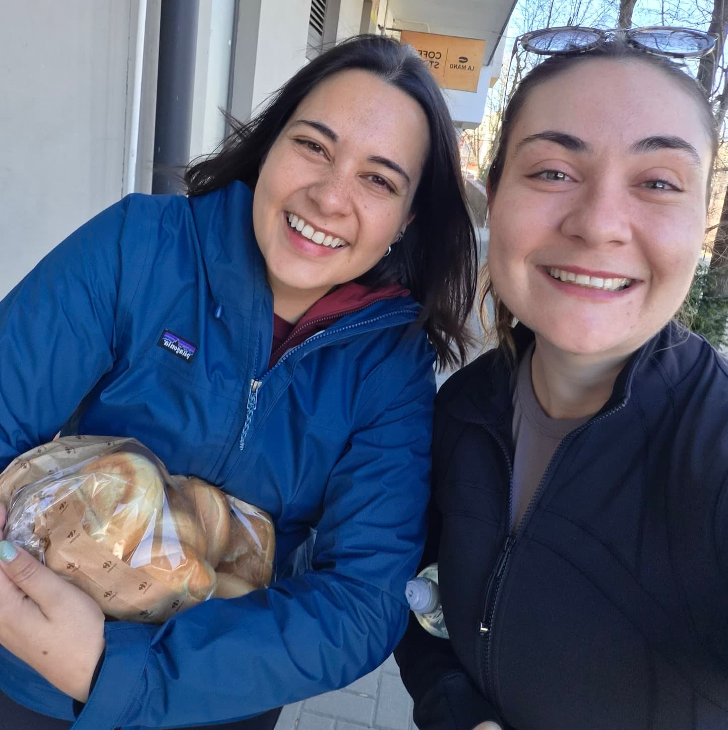 Jacqui and Ellie smiling together outdoors in Poland
