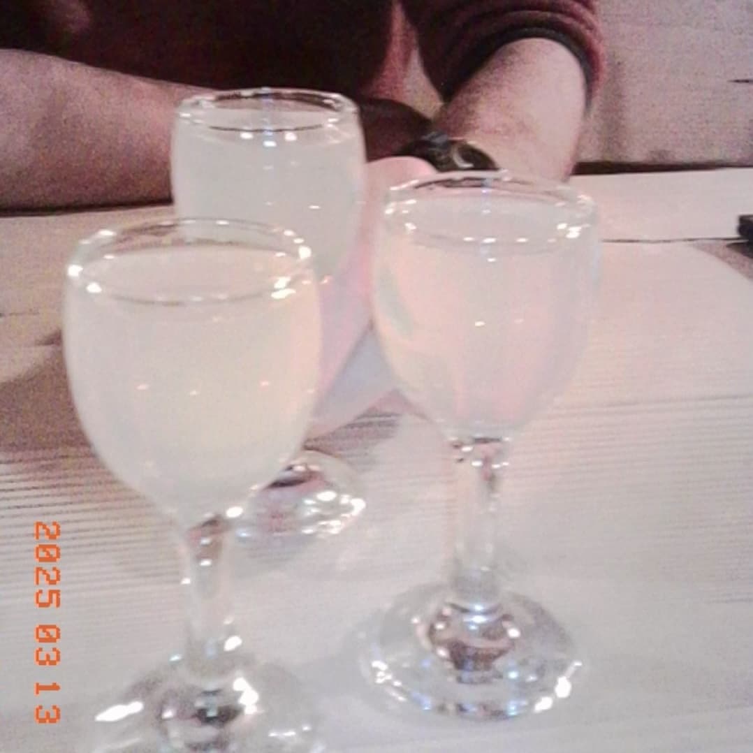 A small glass of lemon vodka on the restaurant table